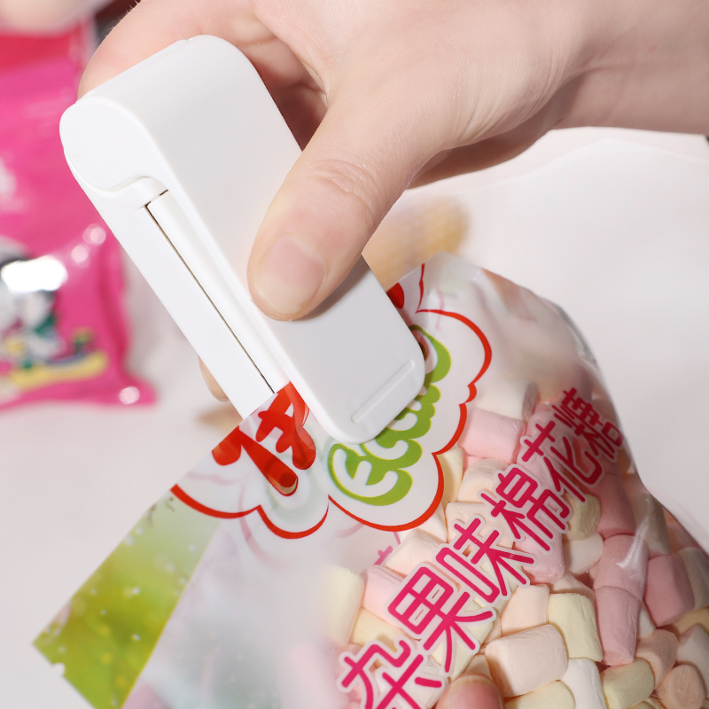 日本迷你加热封口机塑料袋封口器茶叶零食封口夹手压电热密封机