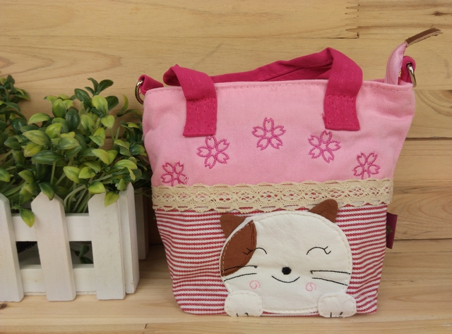 专柜正品QQ猫 微笑的猫咪手提包 可爱女士拎包 卡通拼布女包袋折扣优惠信息
