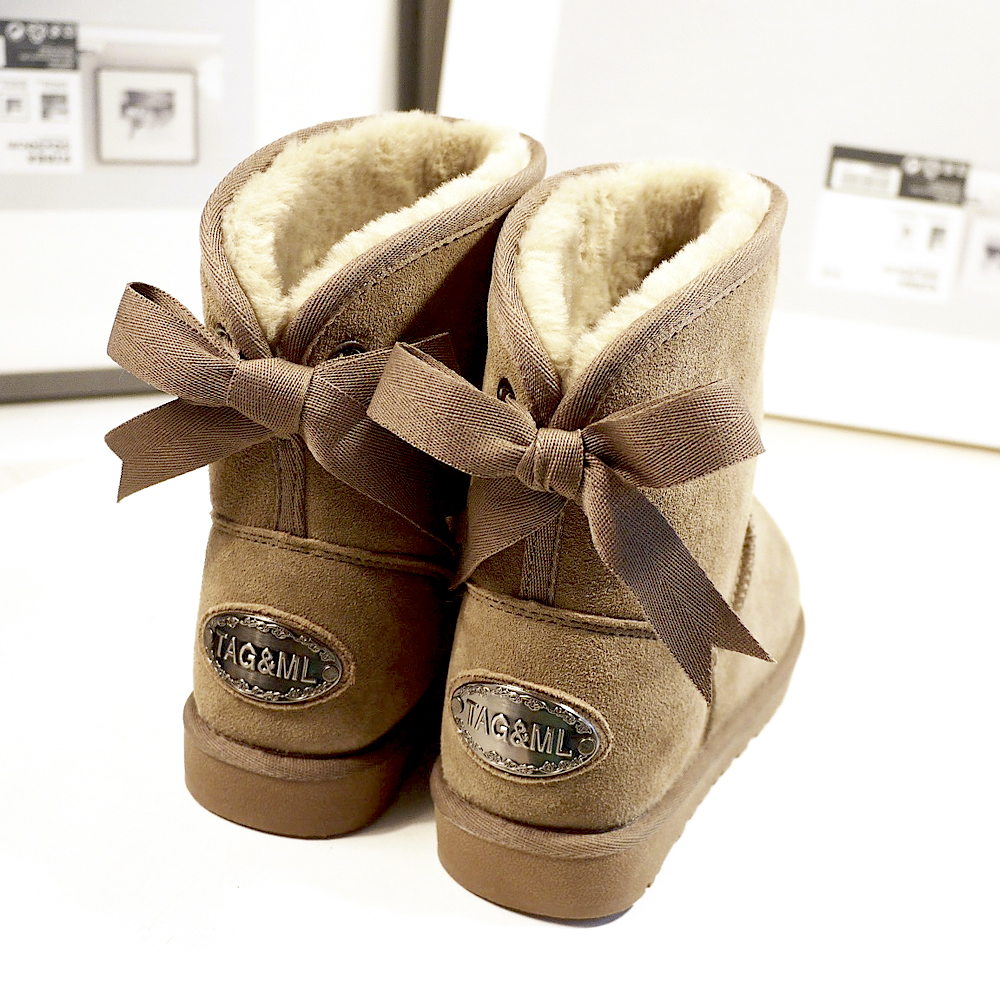 冬季韩版糖果色蝴蝶结雪地靴真皮保暖中筒防滑女靴学生可爱平底棉